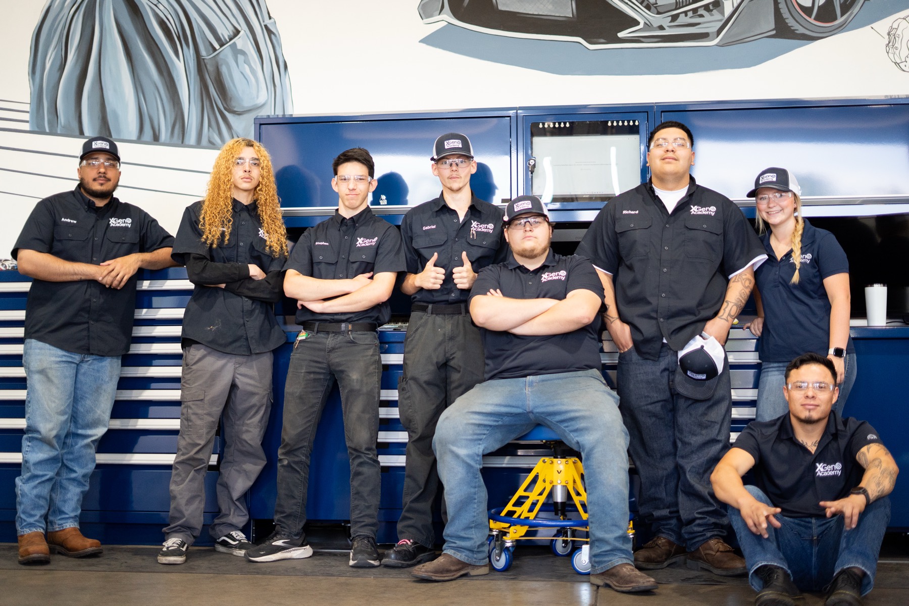 Student training on tire service equipment